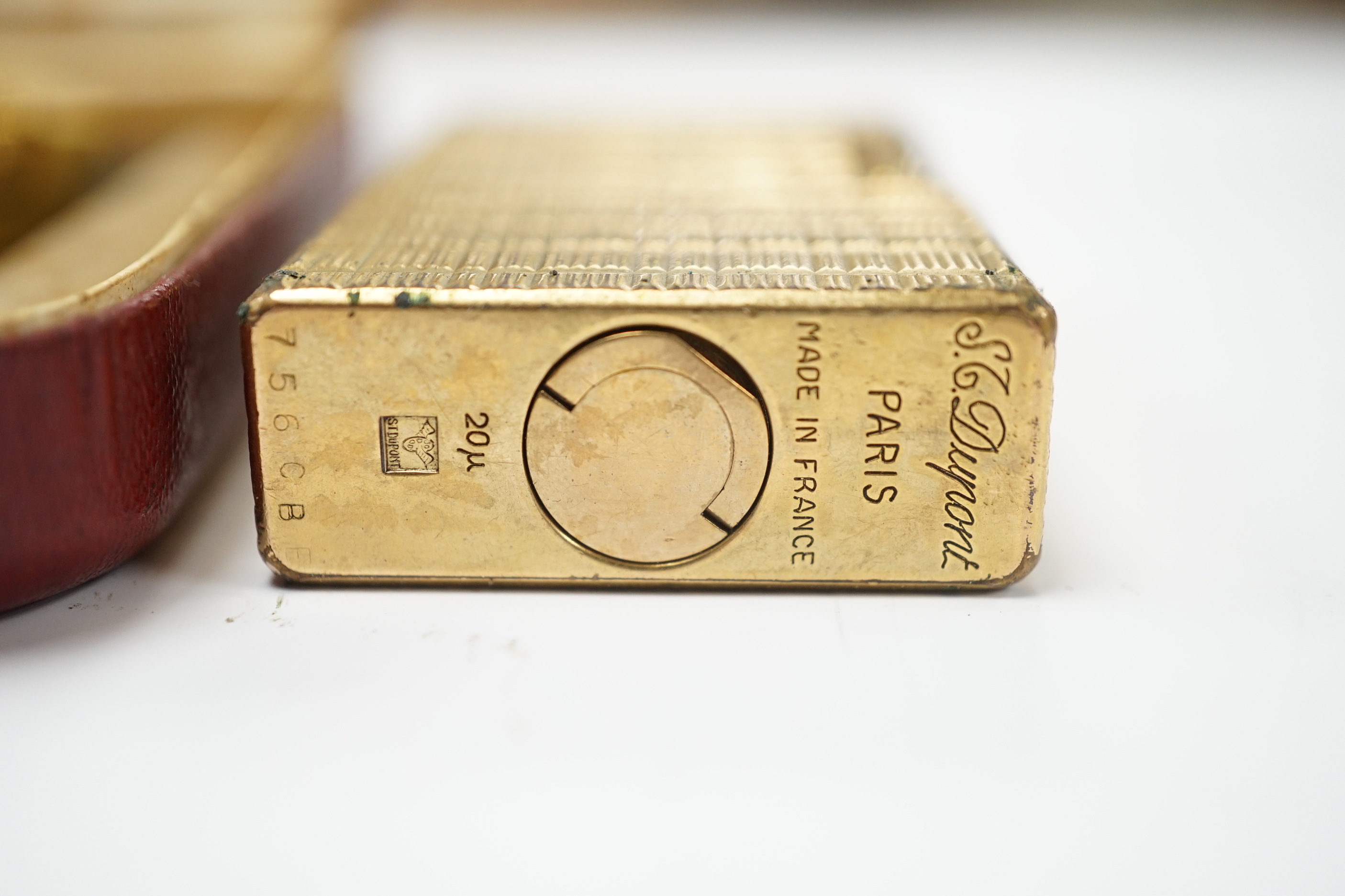 A cased Dunhill lighter, a DuPont lighter and a Thorens lighter